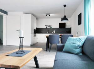 a living room with a couch and a table at Fuchsbau in Baiersbronn