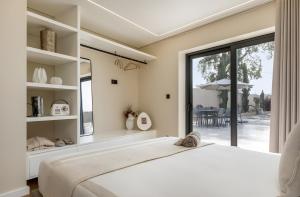 a bedroom with a large bed and a large window at Casa D'avó Amália in Travanca +33 photos