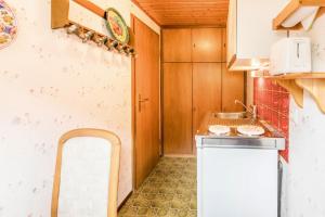 a small kitchen with a sink and a counter at Am Wehrastrand App 4 in Todtmoos