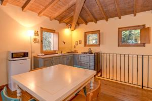 a kitchen with a table and chairs in a room at Colleincanto Appartamento Torretta in Gavardo