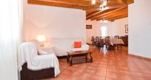 a living room with a couch and a table at Can Mates Nou in Campos