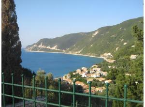 a view of a village and a body of water at Villa Milia in Agios Nikitas