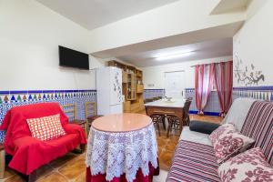 a living room with a couch and a table at Casa rural Mccoy 2 in Macael
