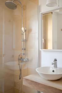 a bathroom with a sink and a shower at 1 Linea Playa , 3 Dorm Islantilla in Isla Cristina +13 photos