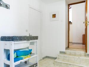 a room with a white counter and a door at Le Cocon in Villalier +17 photos