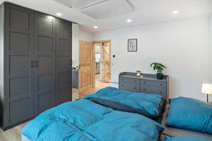 a bedroom with two beds and a closet at Ferienwohnung Wittle in Weiler-Simmerberg