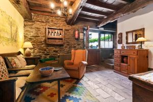 a living room with a couch and a table at Casa Rural Casa Mario in Cangas del Narcea