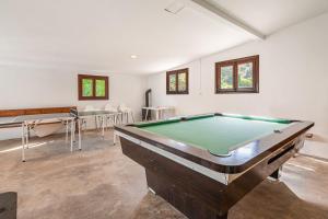a large room with a pool table in it at Can Faveta in Alcudia