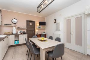 a kitchen and dining room with a table and chairs at Pentefur Suite Savoca in Savoca +35 photos