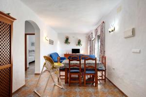 a dining room with a table and chairs at Las Calas de Roche in Roche