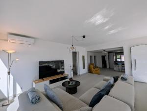 a living room with two couches and a couch at R-70 Oasis in Ciudad Quesada