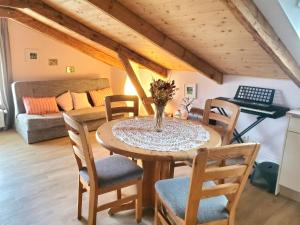 a dining room with a table and chairs at Altes Landhaus in Behrendorf