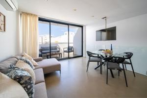 a living room with a couch and a table at Kay lava in Famara