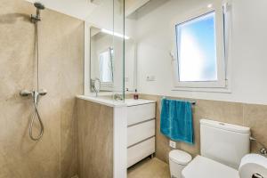 a bathroom with a shower and a toilet and a sink at Els Arbocers 131-2 in Cala Blanca +24 photos