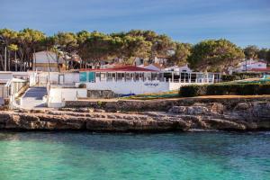 a view of a resort from the water at Els Arbocers 131-2 in Cala Blanca