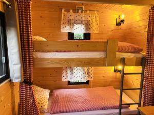 a bedroom with two bunk beds in a cabin at Chalet Josef in Braunsbedra