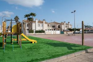 a playground with a slide in a park at Hygee in San Javier