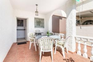 a dining room with a table and chairs at Hygee in San Javier