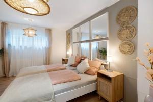 a bedroom with a bed and a large window at Modern und gemütlich- in Teningen in Teningen