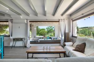 a living room with a couch and a table at Finca encanto in Arcos de la Frontera