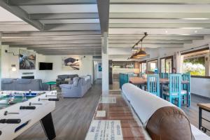 a living room with a couch and tables and chairs at Finca encanto in Arcos de la Frontera
