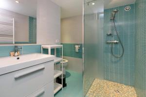 a bathroom with a sink and a glass shower at Maison et Bonheur in Batz-sur-Mer +17 photos