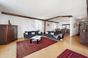 a living room with a couch and a table at Zeughaus Ferienwohnung in Überlingen +34 photos