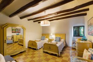 a bedroom with two beds and a large mirror at Casa Espigol in El Bruc +32 photos