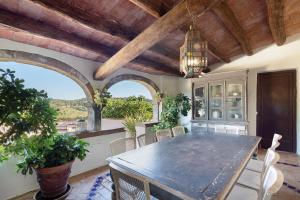a dining room with a table and chairs at Casa Espigol in El Bruc