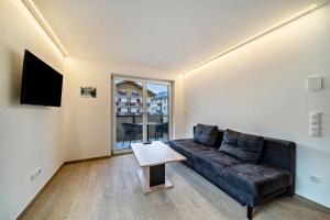 a living room with a couch and a table at Ferienwohnung Lamm 2 in San Valentino alla Muta
