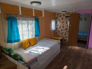 a bedroom with a bed in a small room at Horyna - Camp Pod kastany in Morávka +10 photos