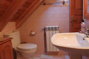 a bathroom with a toilet and a sink at Casa Es De Bernat 2 in Garós