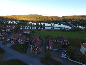 an aerial view of a house with a lake at Gästgivars vandrarhem och B&B in Järvsö
