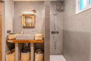 a bathroom with a sink and a shower at Cal Manyà in Susqueda +27 photos