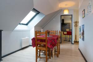 a dining room with a table and a window at Logement Rieux À 6 Km De Redon in Rieux