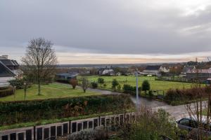 a view of a town with a field and a street at Logement Rieux À 6 Km De Redon in Rieux