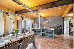 a kitchen and dining room with a table and chairs at Moselbude Cube mit Sauna in Traben-Trarbach