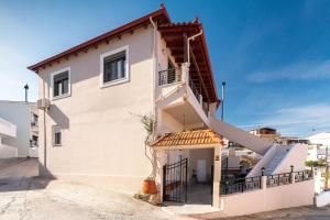 a house with a staircase on the side of it at Villa Despina in Rhodes Town