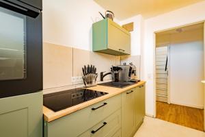 a kitchen with a sink and a microwave at Kim Fewo 4 in Emmendingen