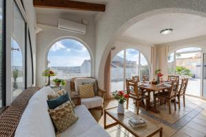 a living room with a couch and a table at Fidalsa Golf Beach in Ciudad Quesada