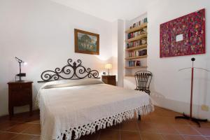 a bedroom with a bed and a book shelf at Casa di Gina in Levanto
