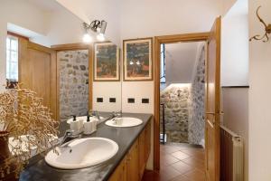 a bathroom with two sinks and a walk in shower at Casa di Gina in Levanto +23 photos