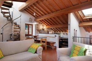 a living room with two couches and a table at Casa di Gina in Levanto