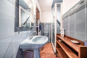 a bathroom with a sink and a mirror at Séjour dans ferme de 1876 in Marignier +19 photos