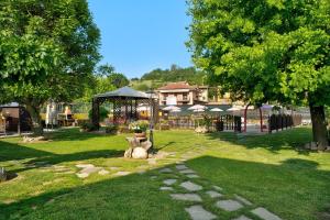 a park with two statues of animals on the grass at Appartamento Glicine in Cisterna dʼAsti