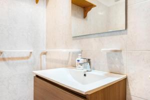 a bathroom with a sink and a mirror at Appartamenti l'Edera in Cavedago +37 photos