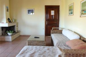 a living room with a couch and a fireplace at Villa Milia in Agios Nikitas +31 photos