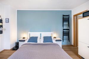 a bedroom with a large bed with two night stands at Ferienwohnung Steinstübchen in Bautzen