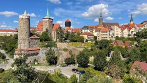 a view of a city with tall towers and buildings at Ferienwohnung Steinstübchen in Bautzen
