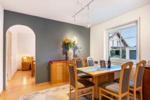 a dining room with a table and chairs at Residenz Malscher Aue in Malsch +12 photos